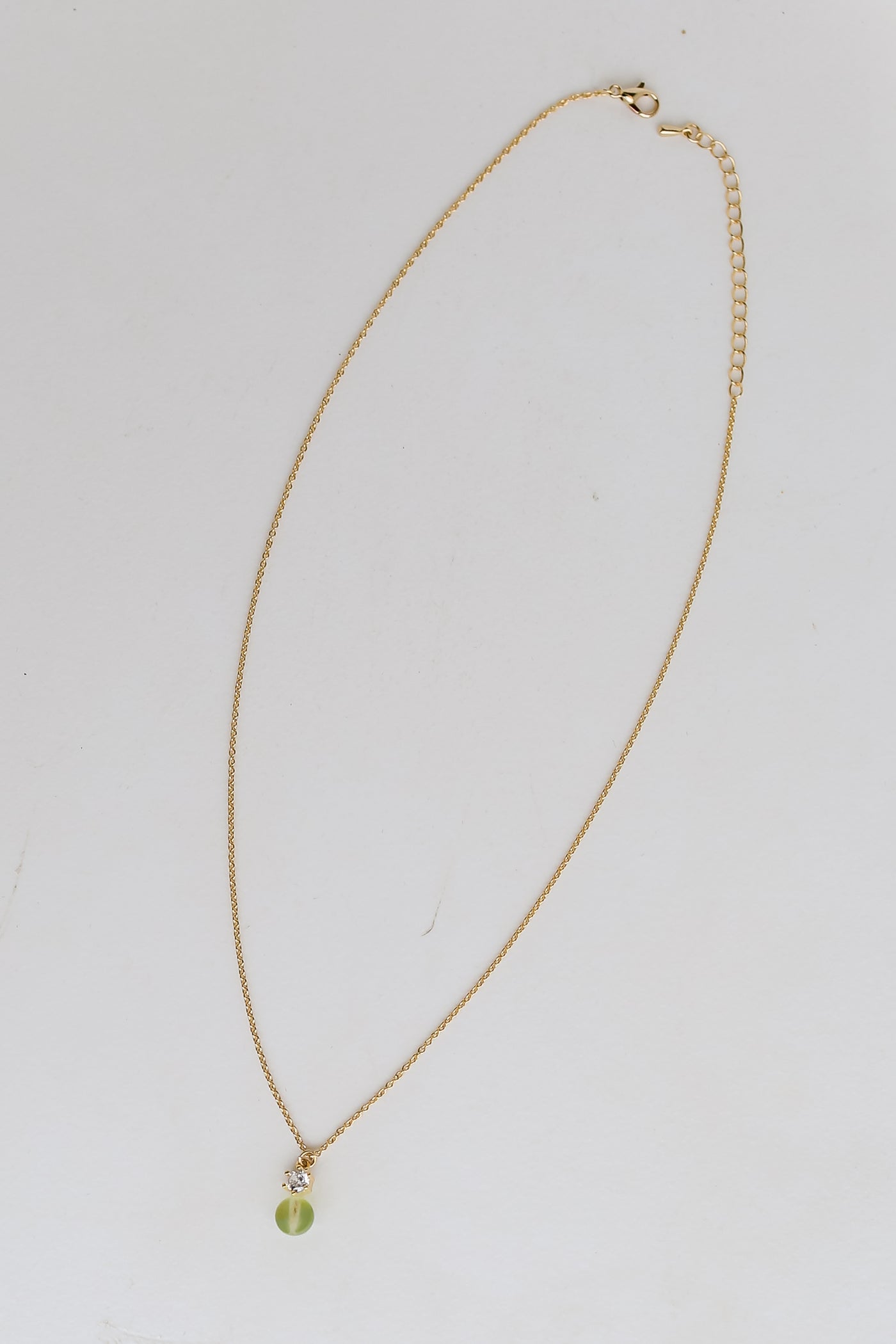 Gold Mini Stone Charm Necklace flat lay