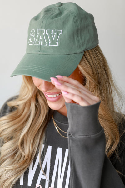 green SAV Embroidered Hat on model