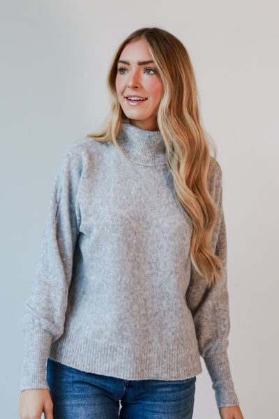 grey sweaters