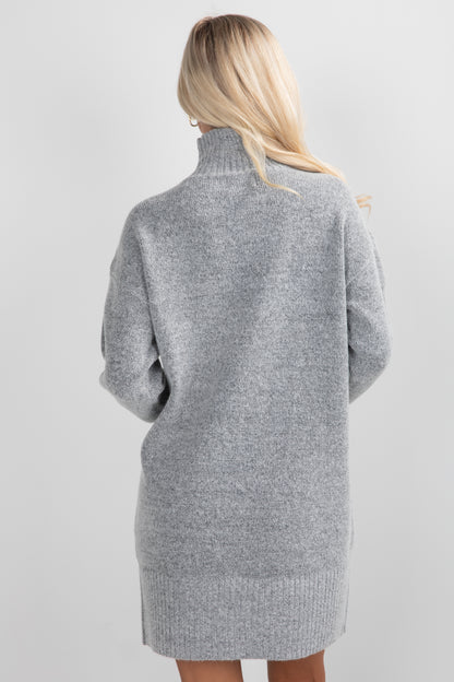 Gray sweater dress worn by a person on a light gray background