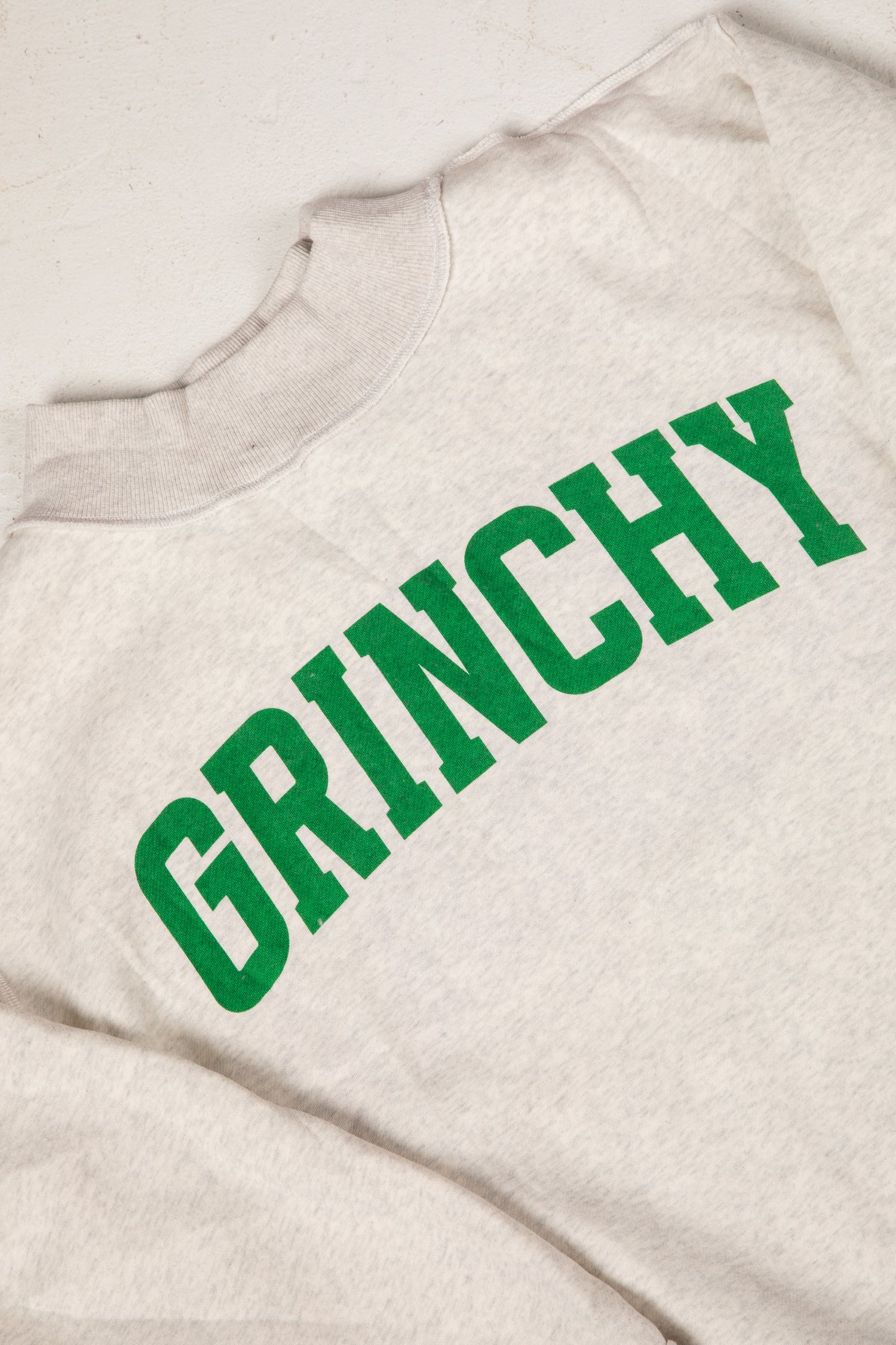 Beige sweatshirt with green &