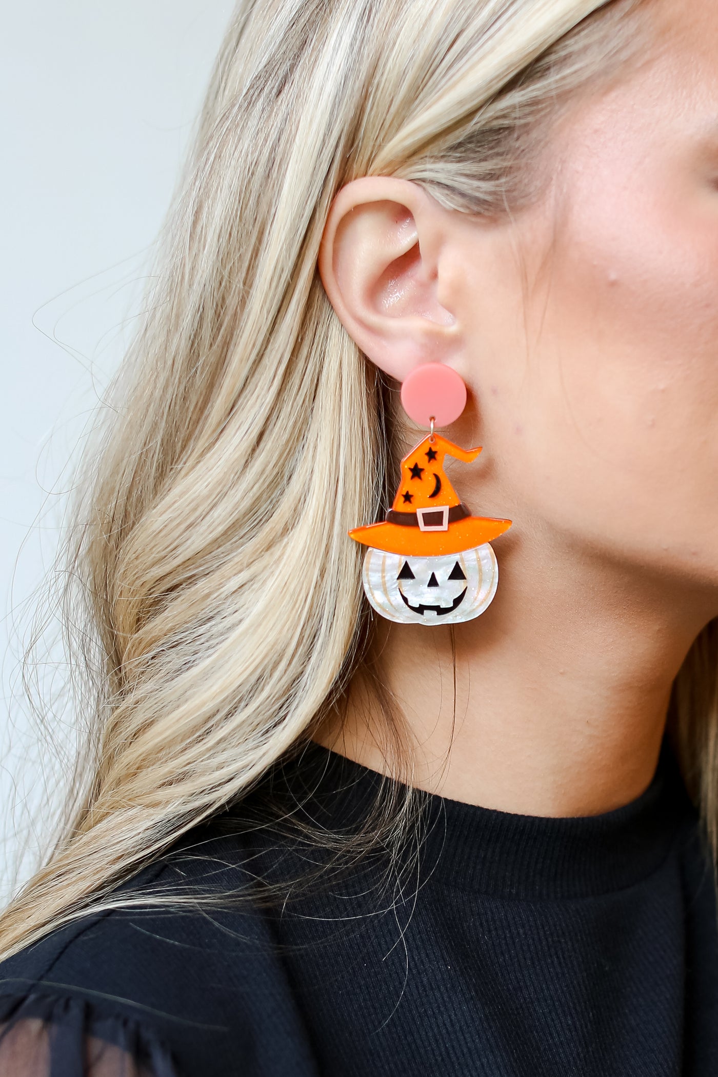 Witch Hat Pumpkin Earrings on model