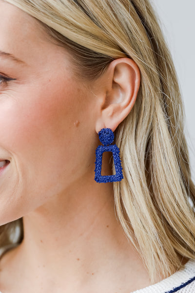 blue Statement Earrings on dress up model