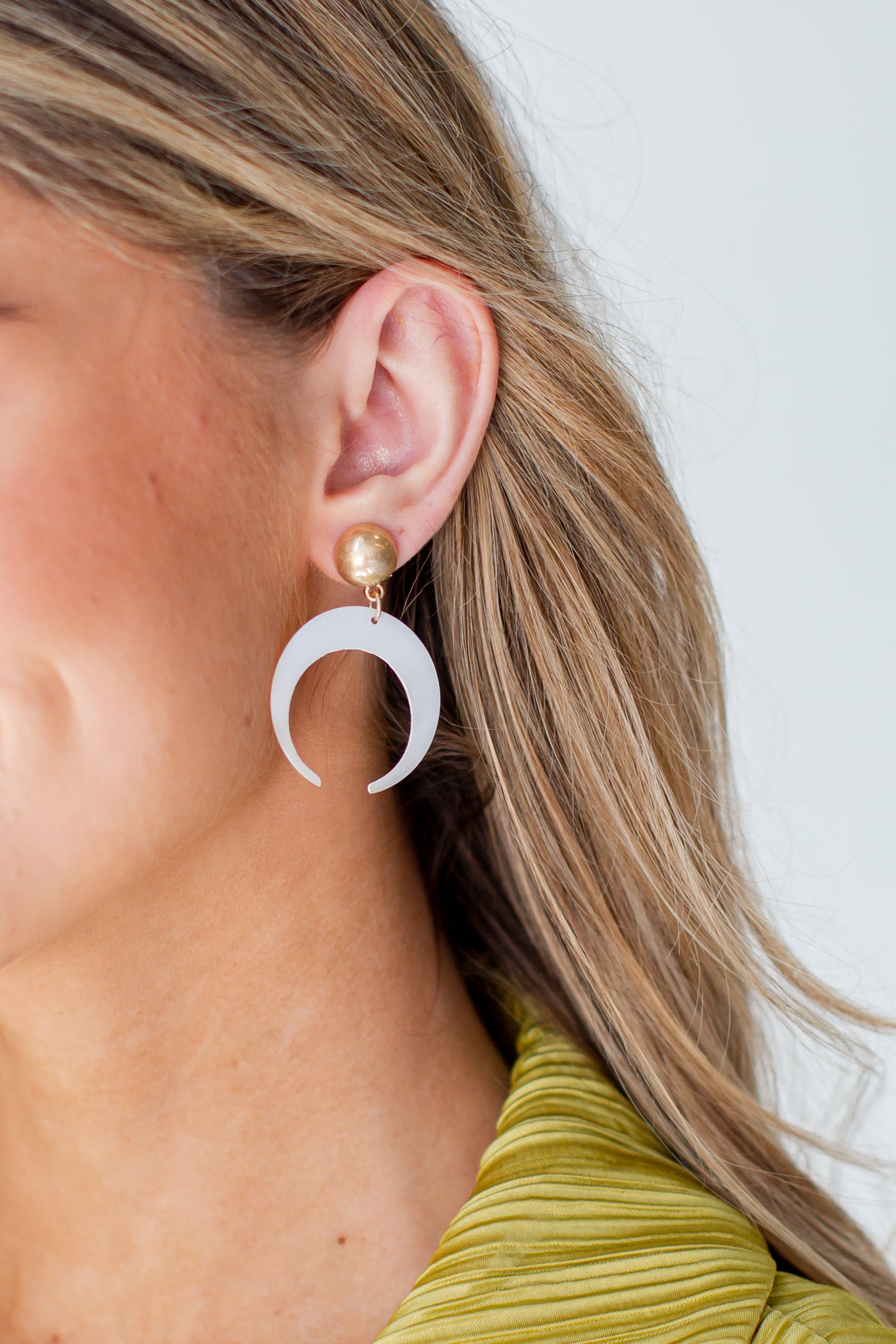 Acrylic Crescent Horn Drop Earrings on model
