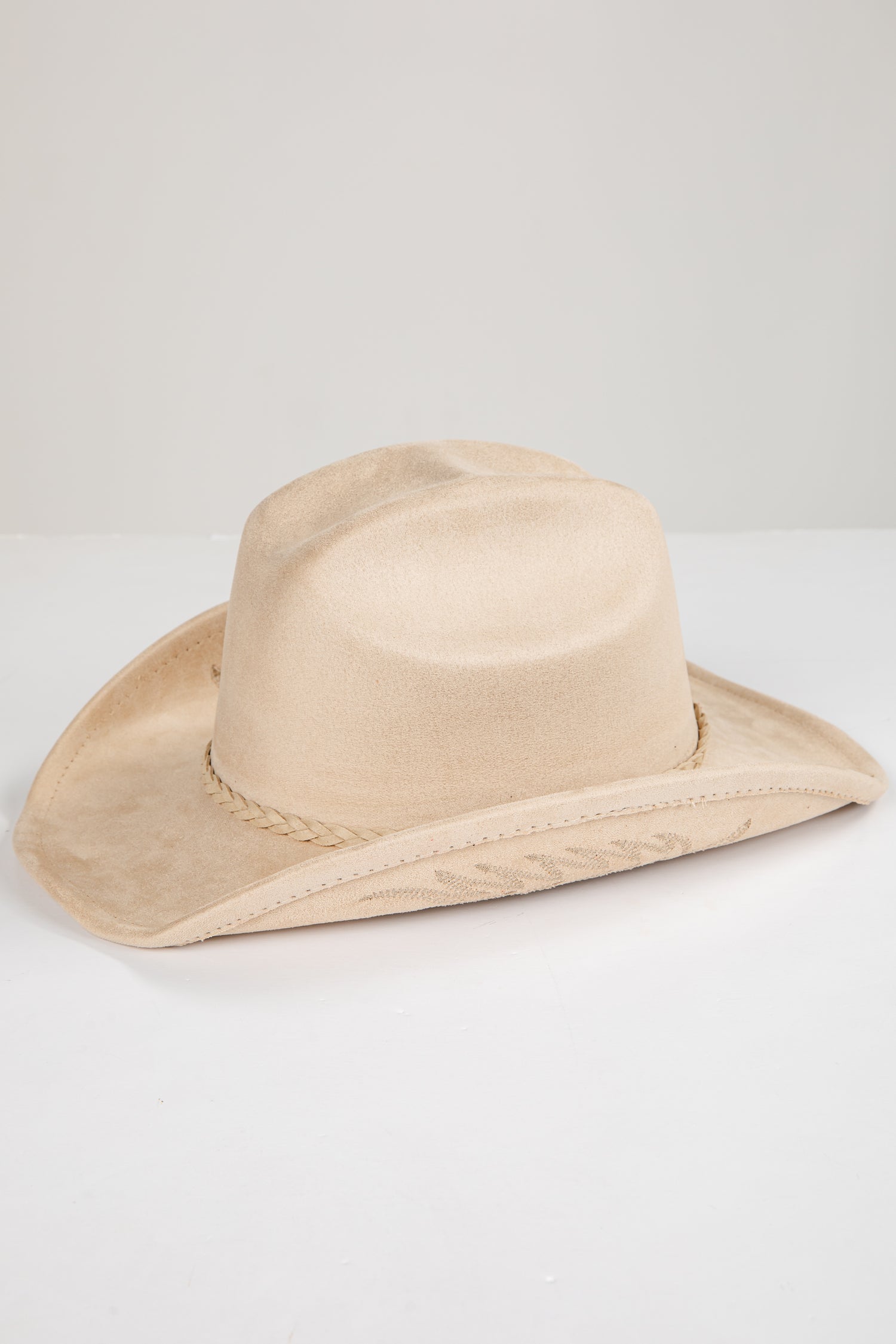 Beige cowboy hat on a white background