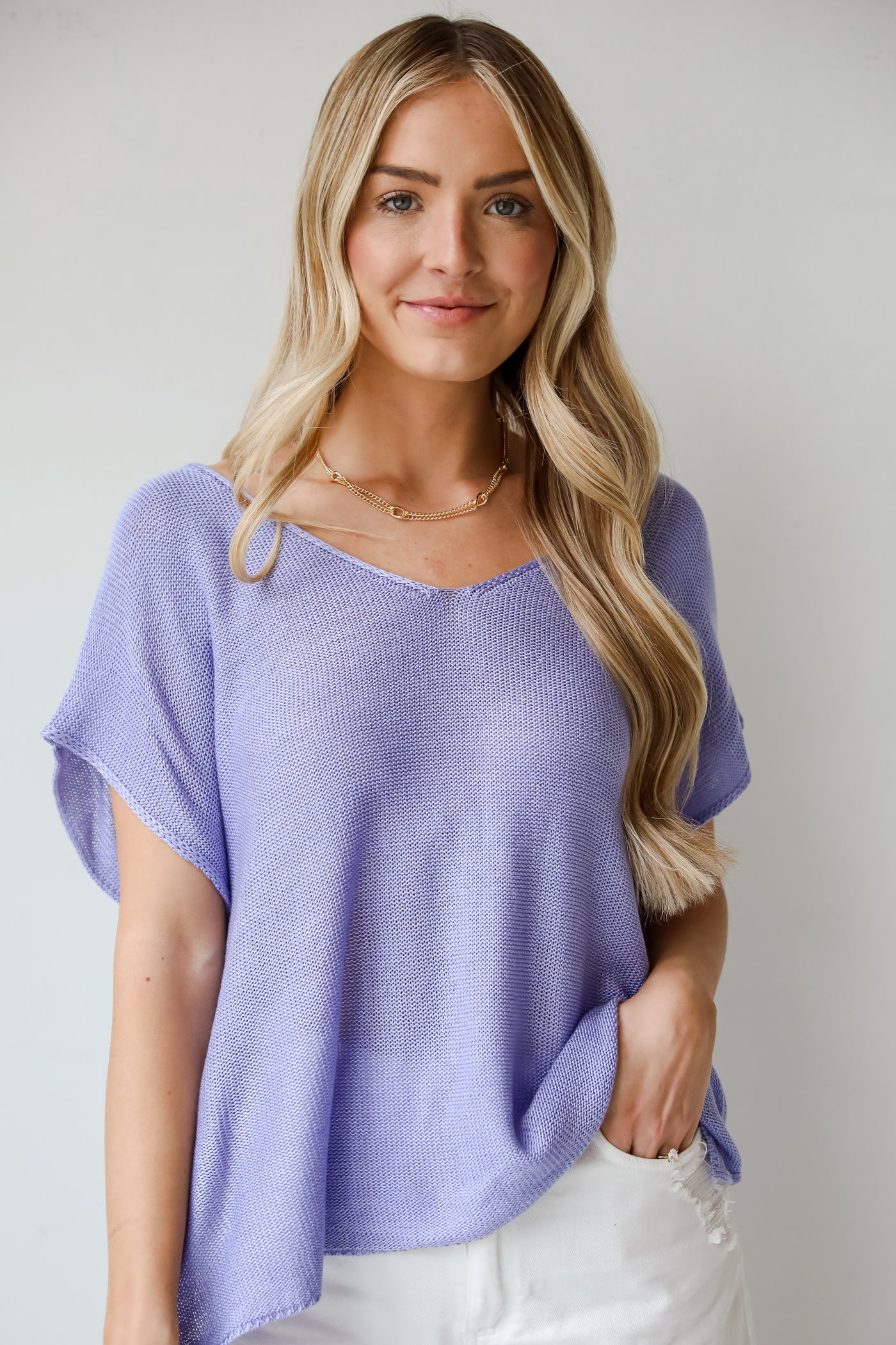 blue Lightweight Knit Top, Eliza Lightweight Knit Top is the perfect spring sweater. Lightweight knit sweater, with v-neck, short sleeves, and oversized fit. Pairs well with denim. Online boutique. 