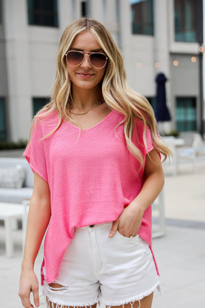 hot pink knit tee, Eliza Lightweight Knit Top is the perfect spring sweater. Lightweight knit sweater, with v-neck, short sleeves, and oversized fit. Pairs well with denim. Online boutique. 