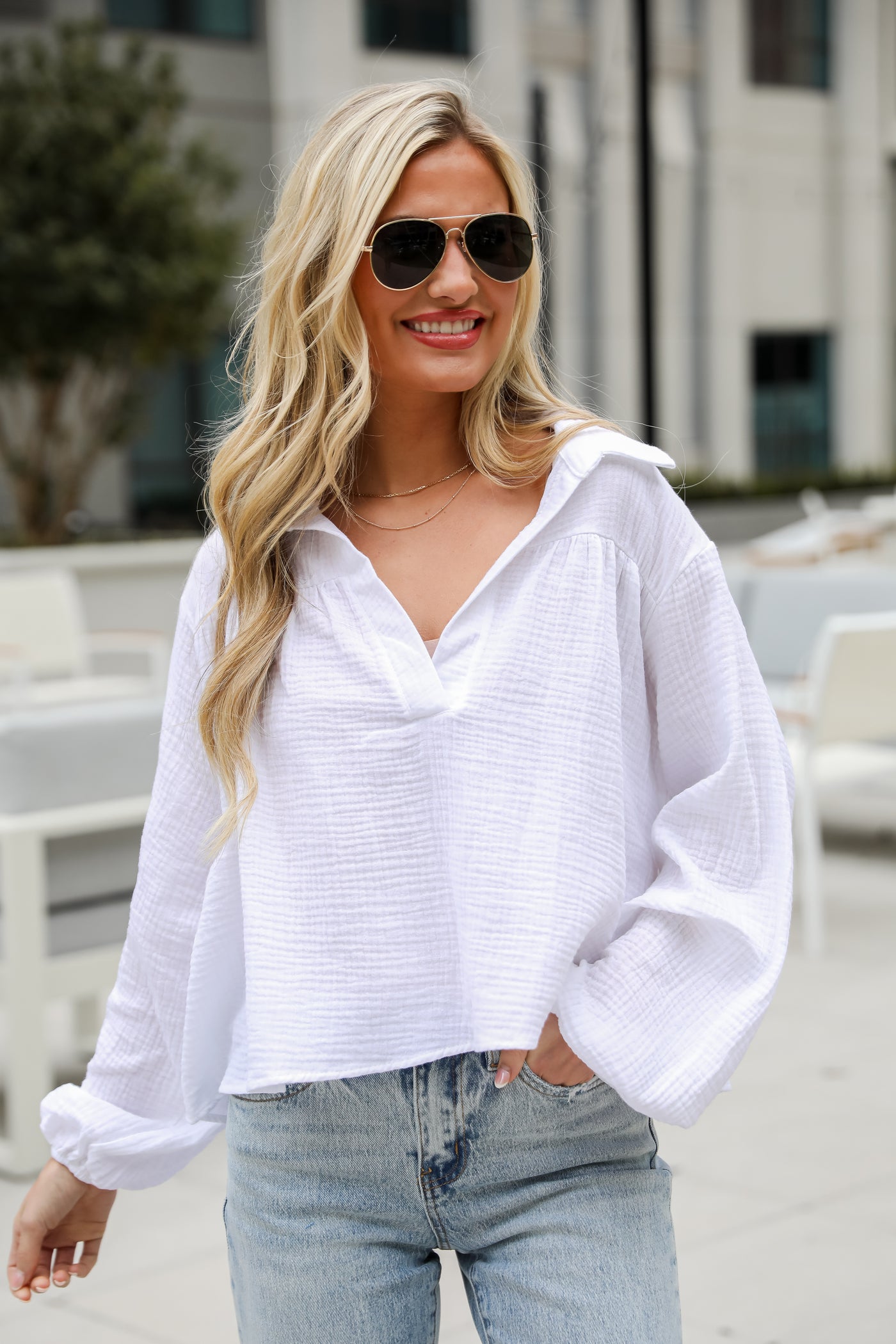 Alanna Linen Blouse is a Lightweight Crinkle Linen top, with a Collared V-Neckline, Long Balloon Sleeves with Elastic Cuffs. Relaxed Fit, 100% Cotton, and the perfect shade of blue and white. boutique tops. Women tops for summer. 