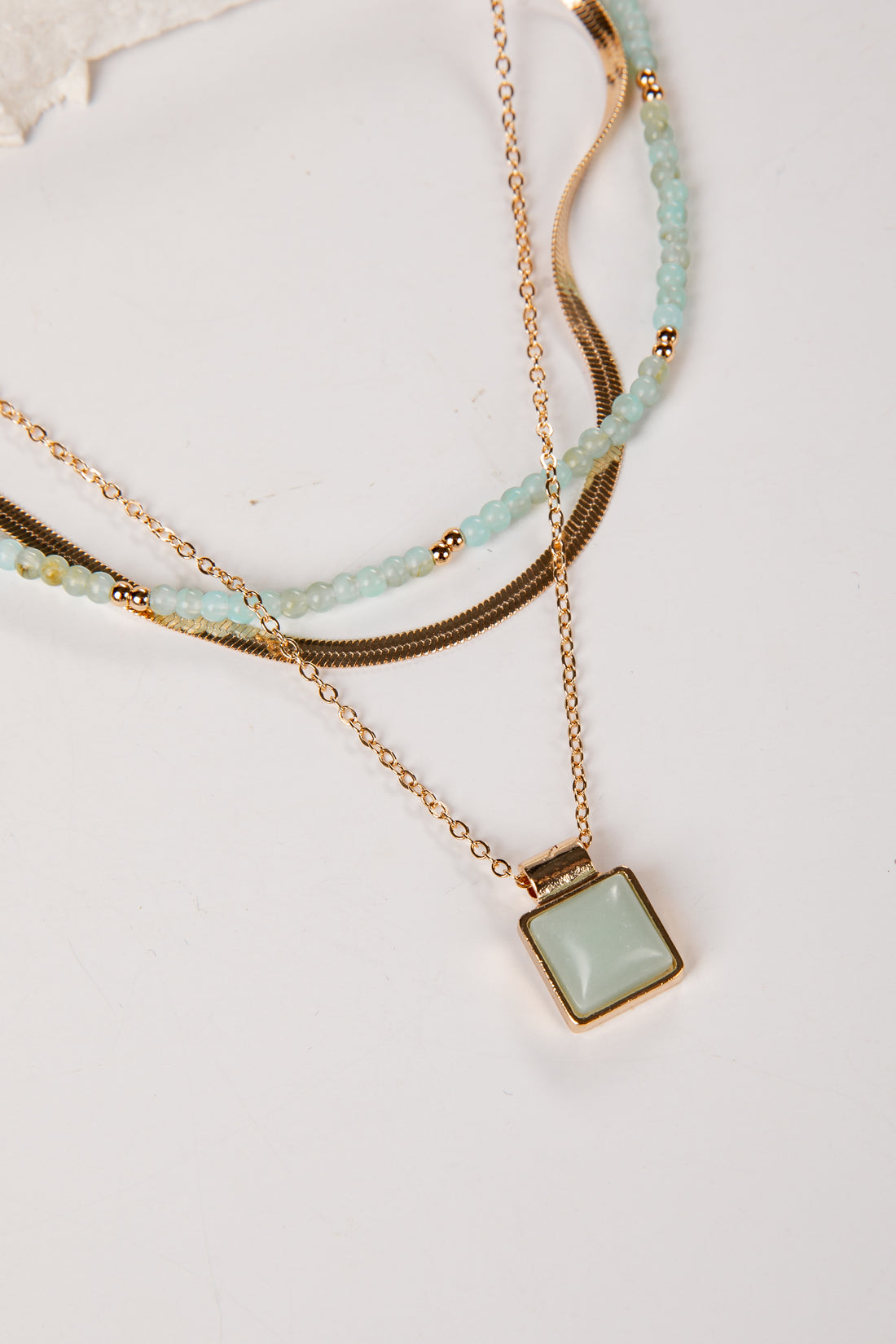 Gold and mint layered necklace with pendant