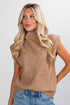 Woman wearing a brown sleeveless sweater against a white background