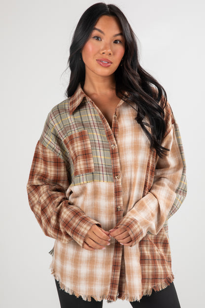 Woman wearing a plaid shirt with a neutral color palette on a white background