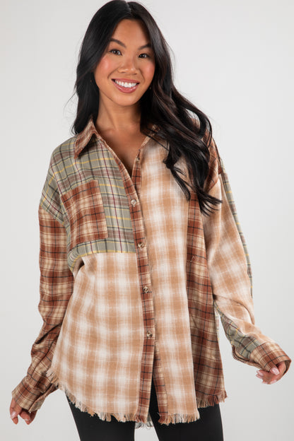 Woman wearing a plaid shirt with a white background