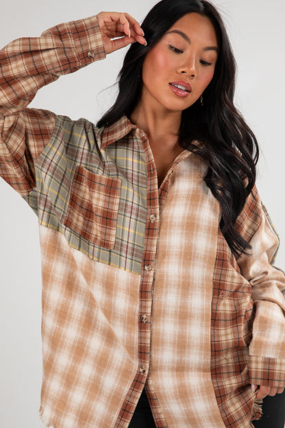 Woman wearing a plaid shirt with a neutral background