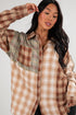 Woman wearing a plaid shirt with a neutral background