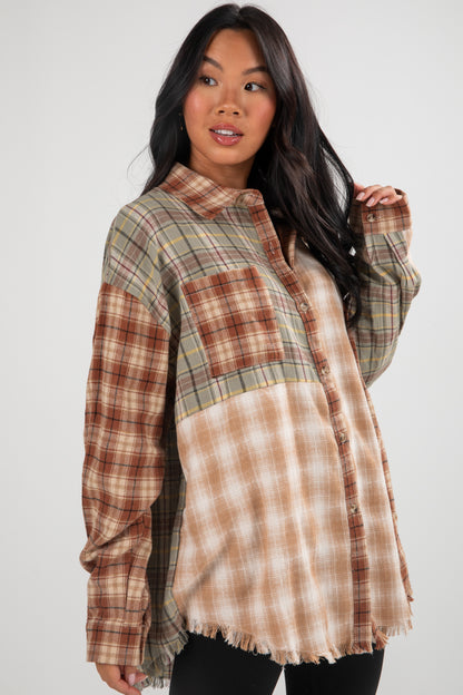 Woman wearing a plaid shirt with a tie-dye pattern underneath on a white background