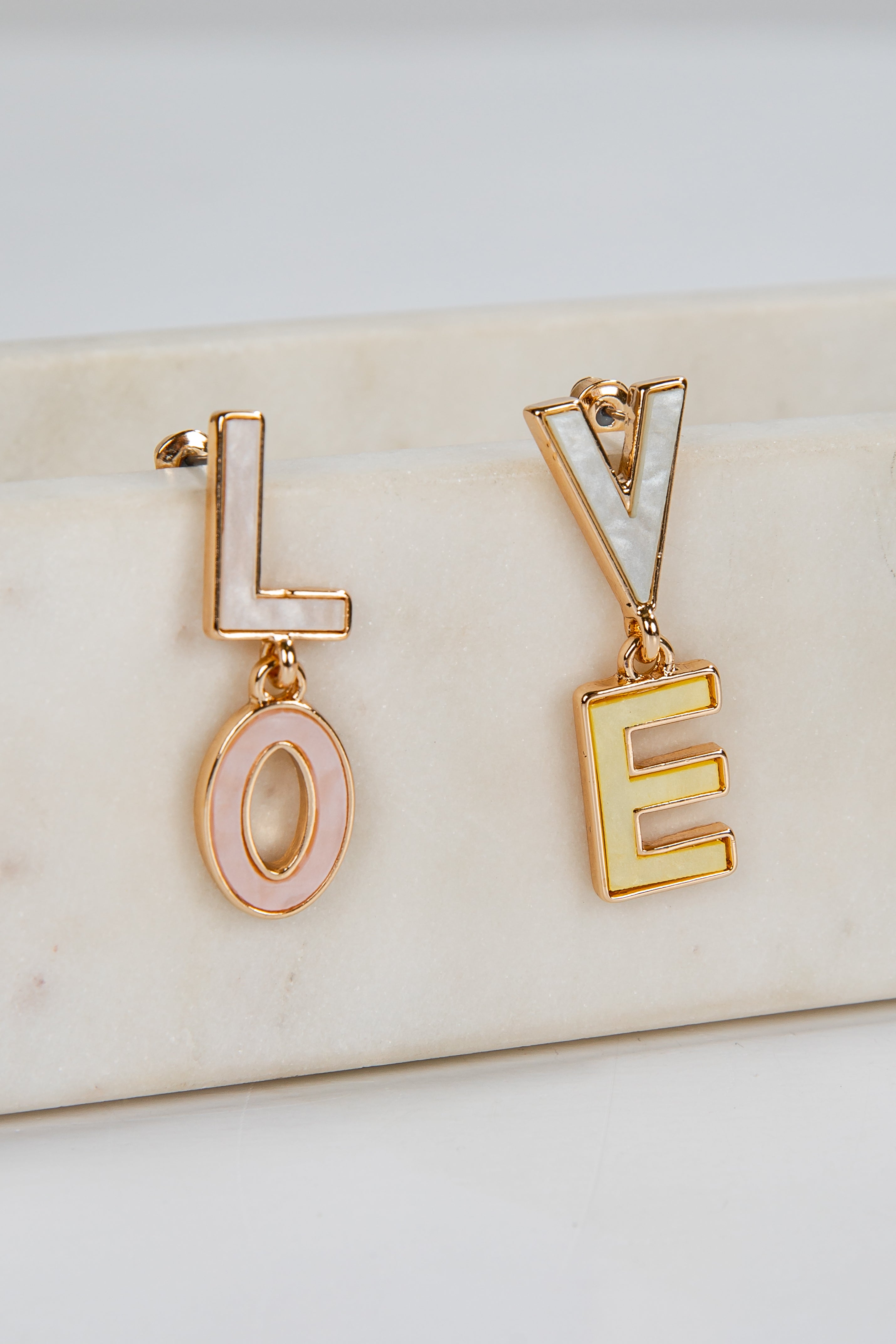 Gold earrings spelling &