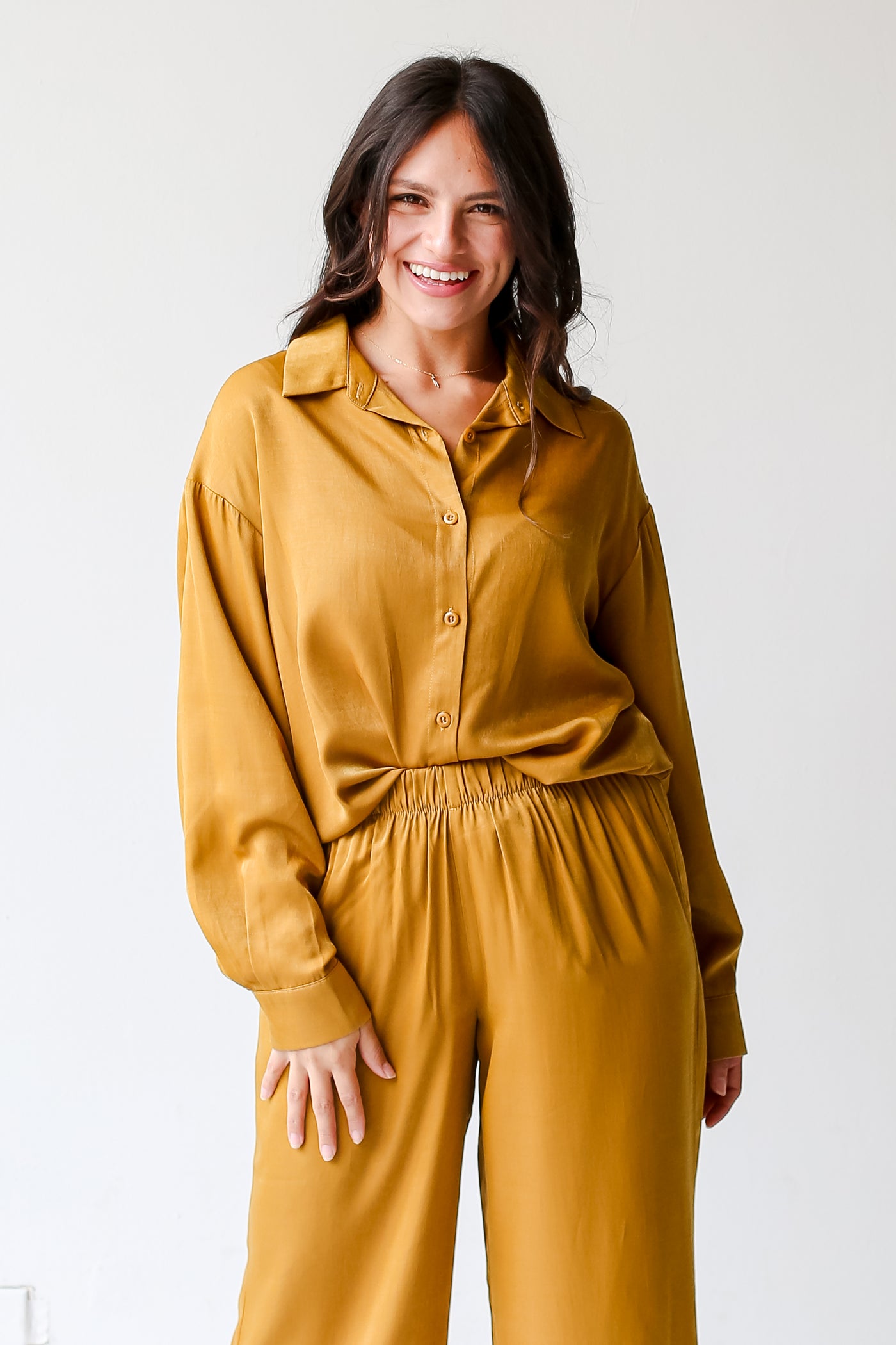 model wearing a yellow Button-Up Blouse