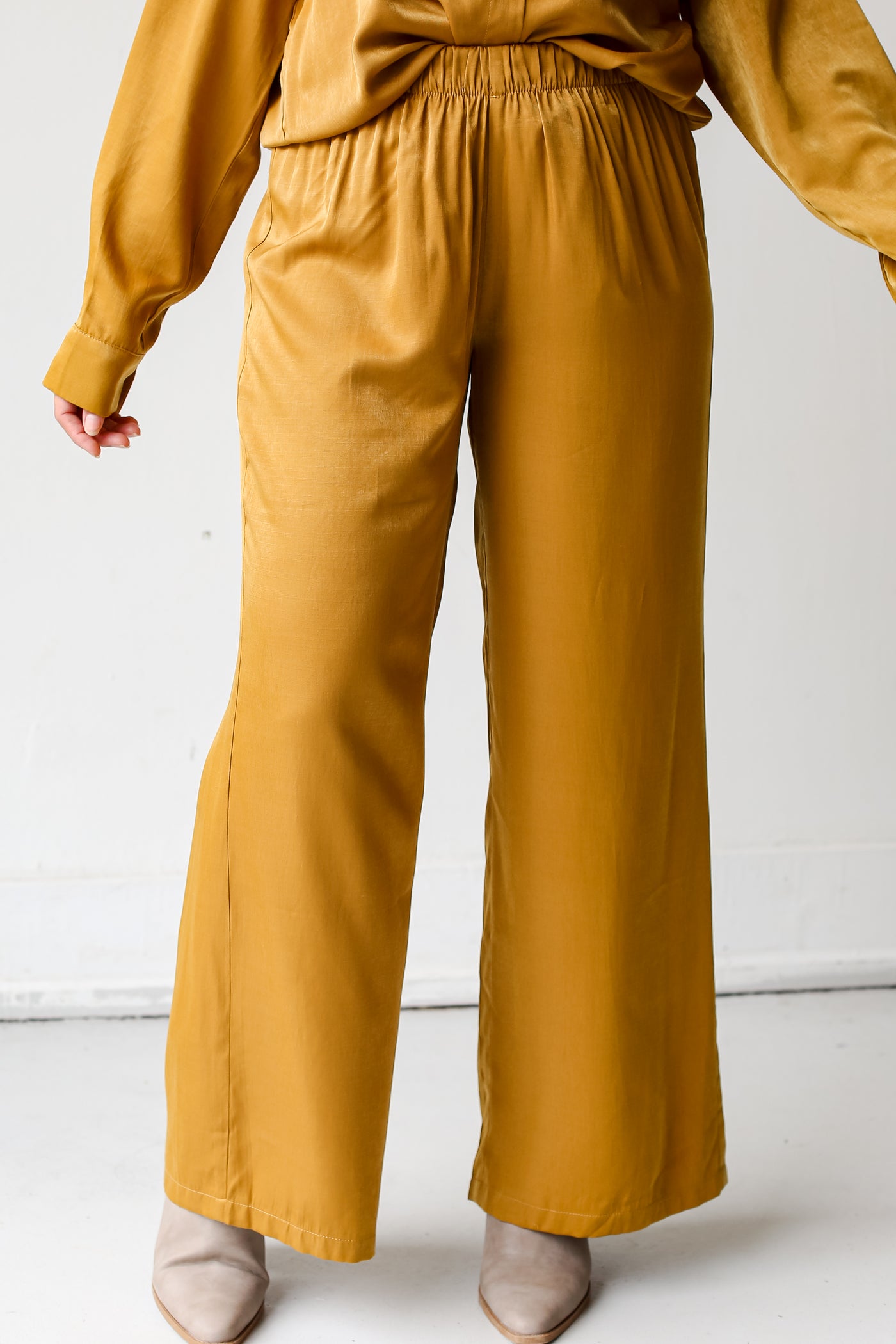 model wearing trendy yellow pants