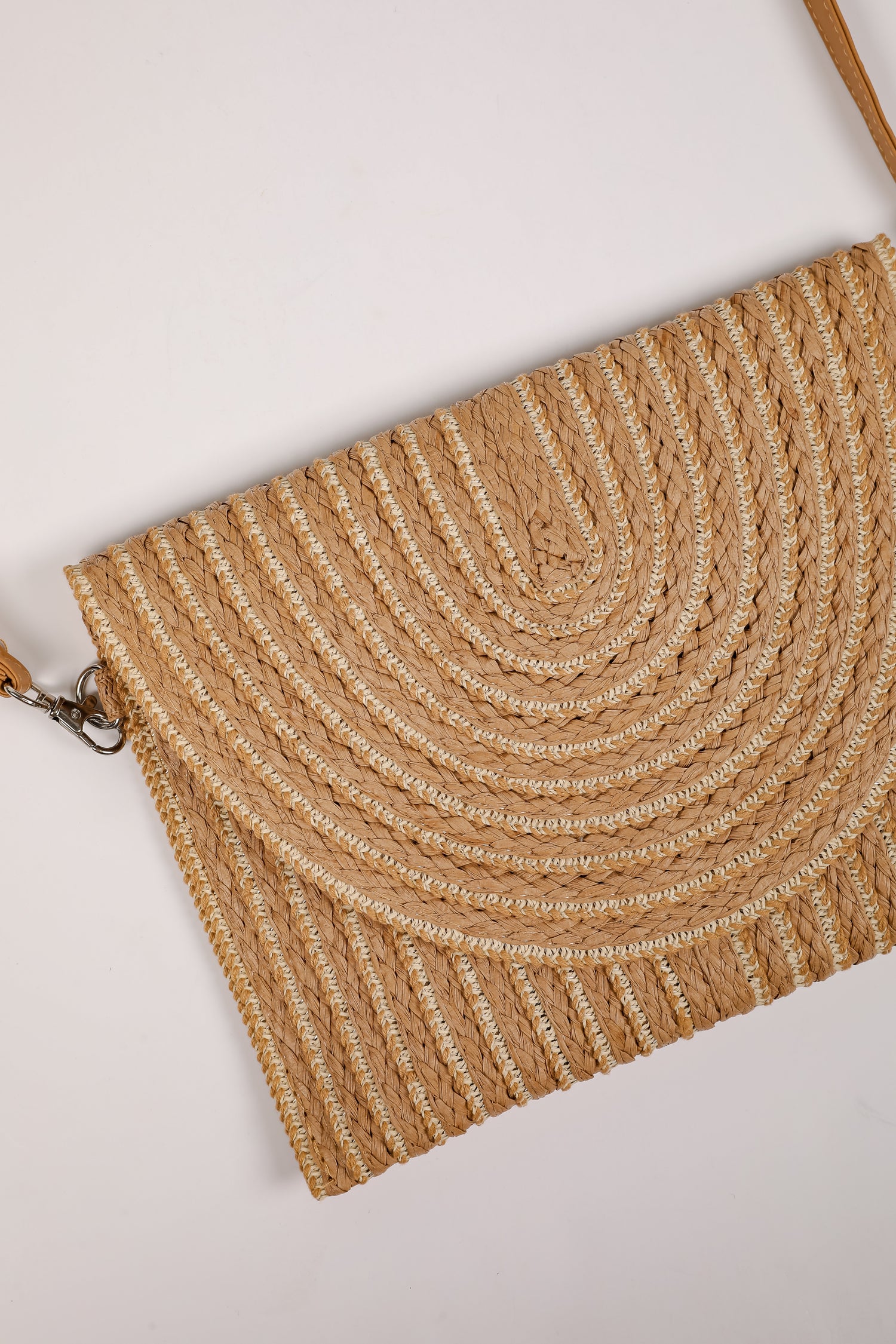 Woven handbag with a textured pattern on a light background