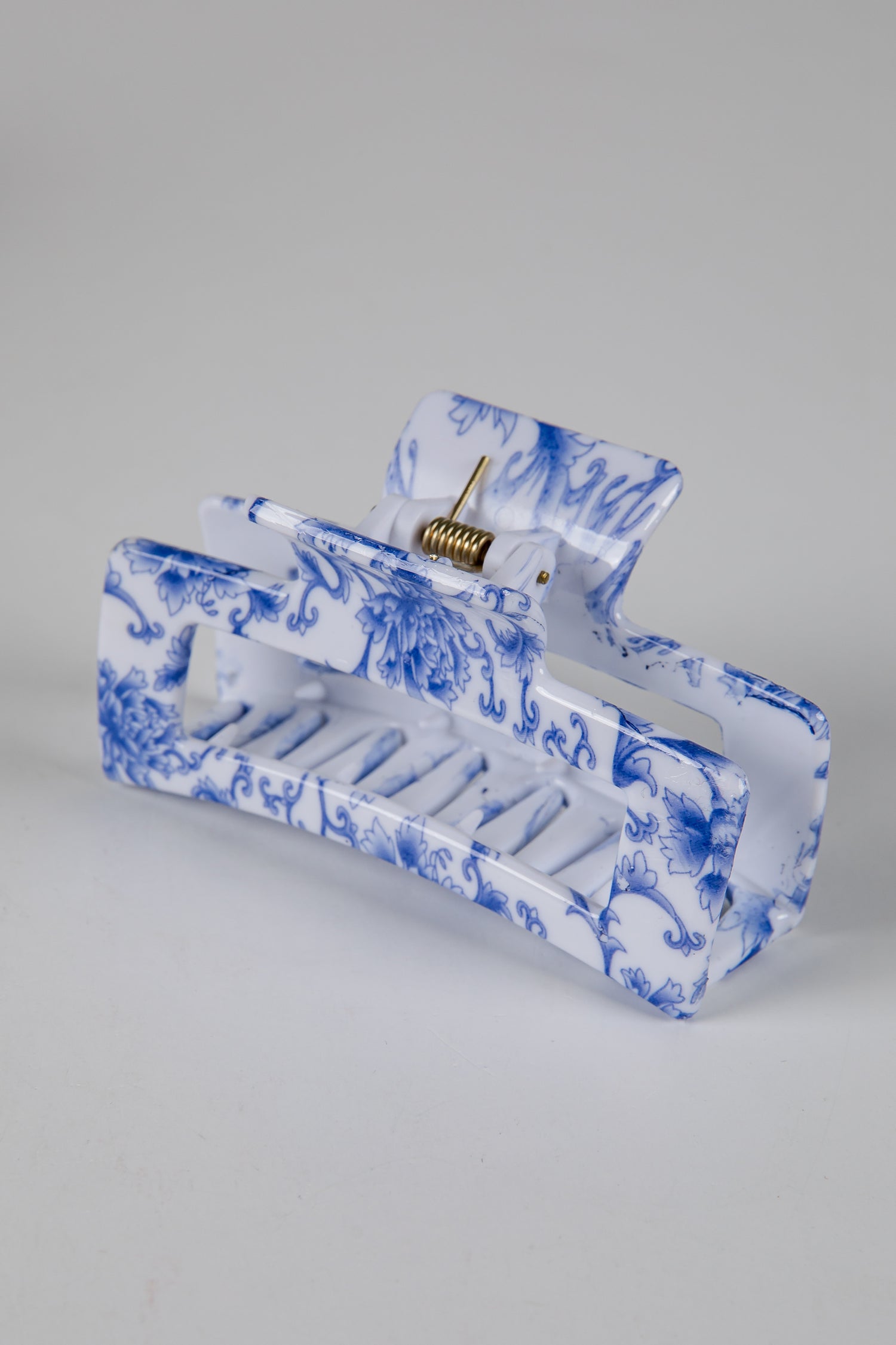 Blue and white marbled design on a rectangular object against a gray background