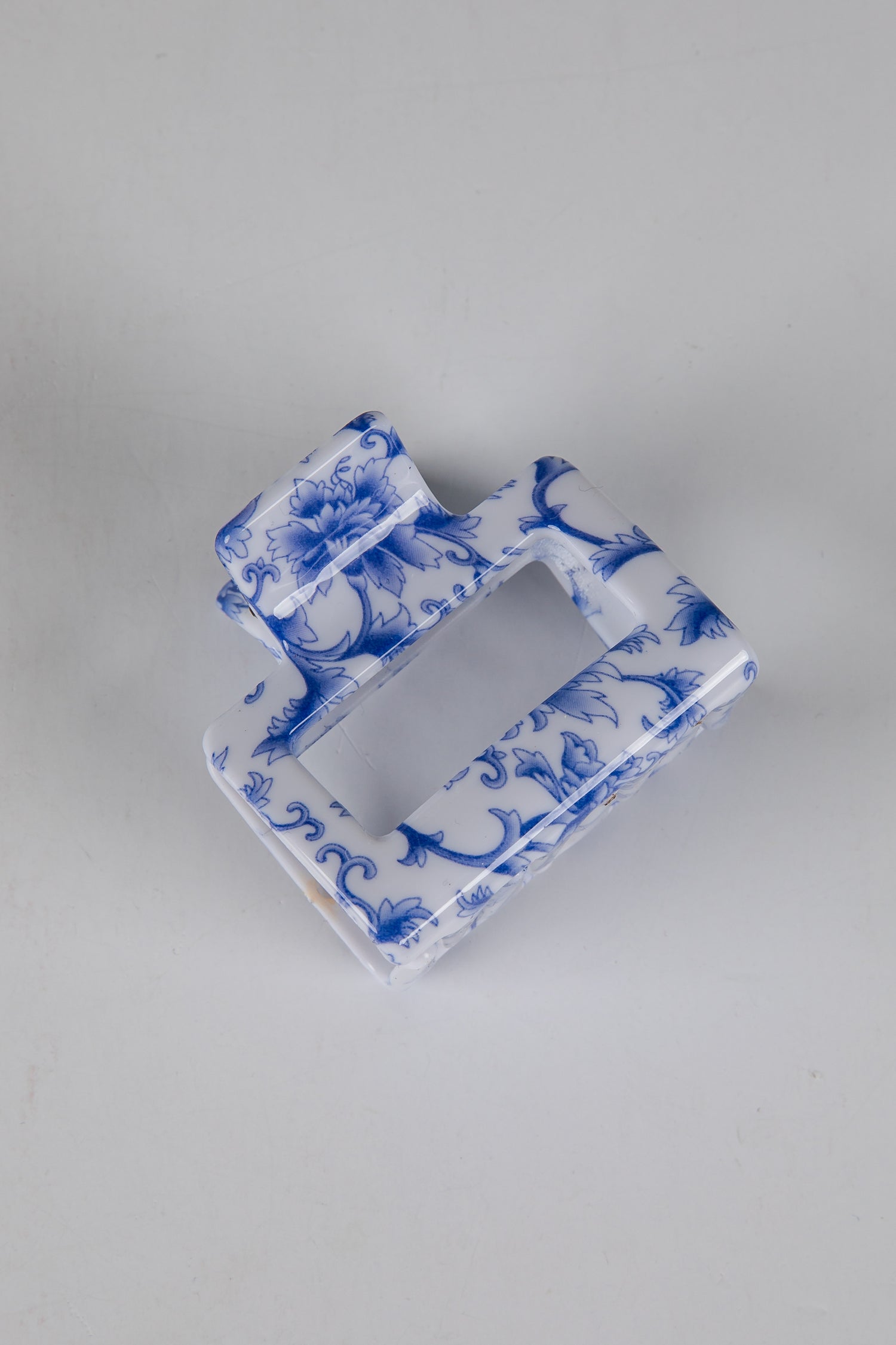 Blue and white decorative item on a gray background
