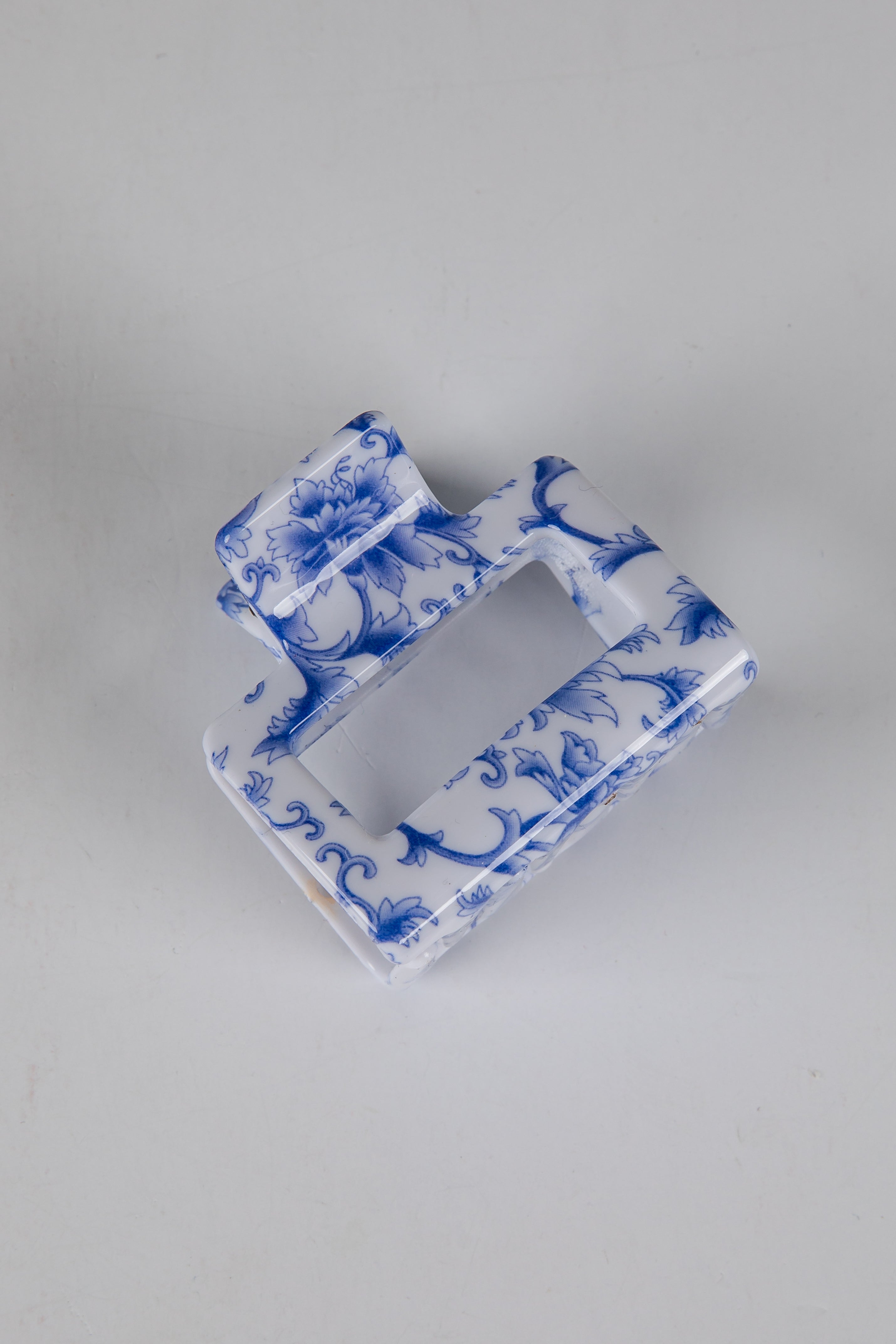 Blue and white decorative item on a gray background