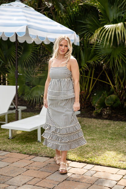 Woman wearing striped maxi skirt. 