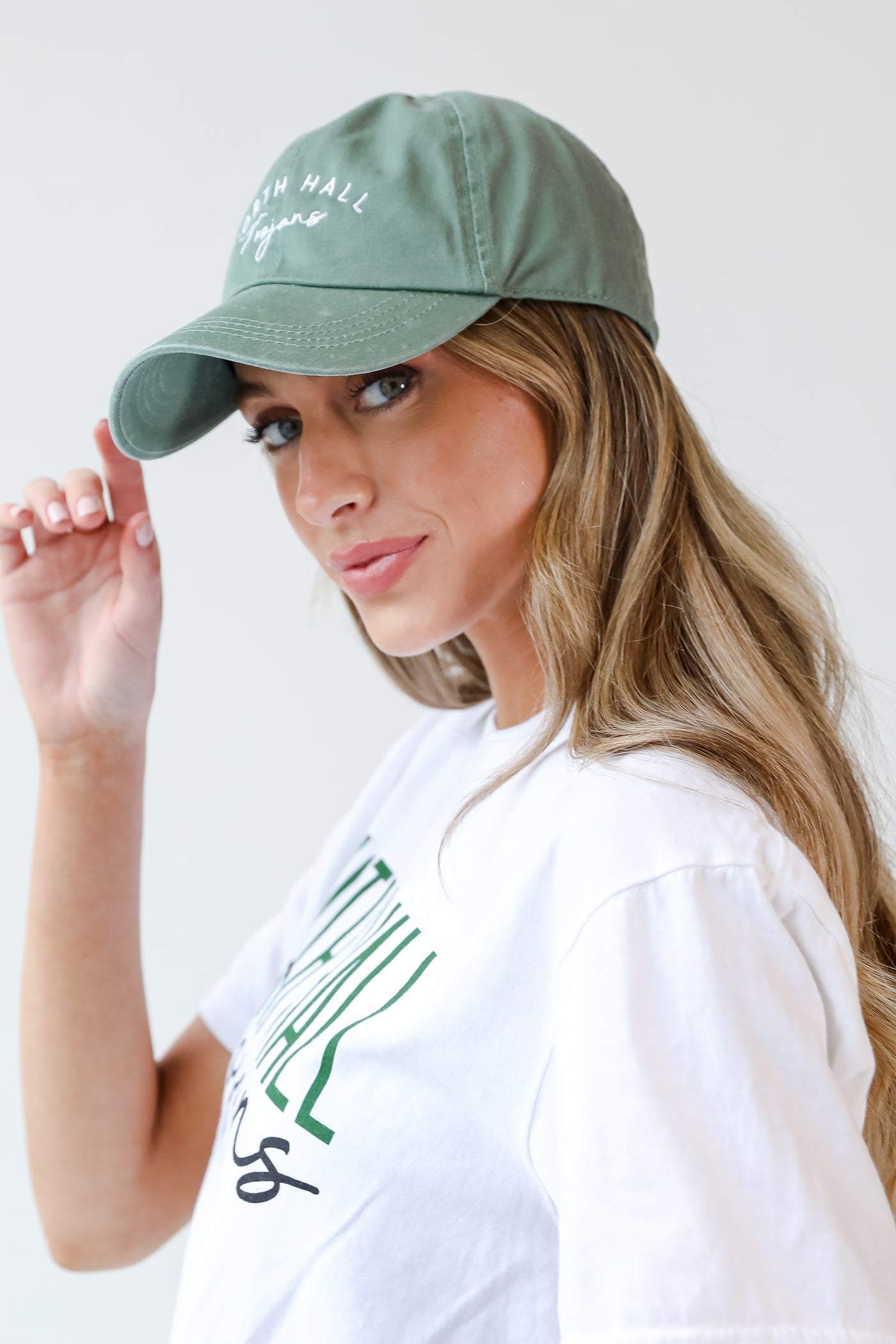 Green North Hall Trojans Embroidered Hat on model
