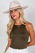 Woman wearing a beige hat and brown tank top on a white background