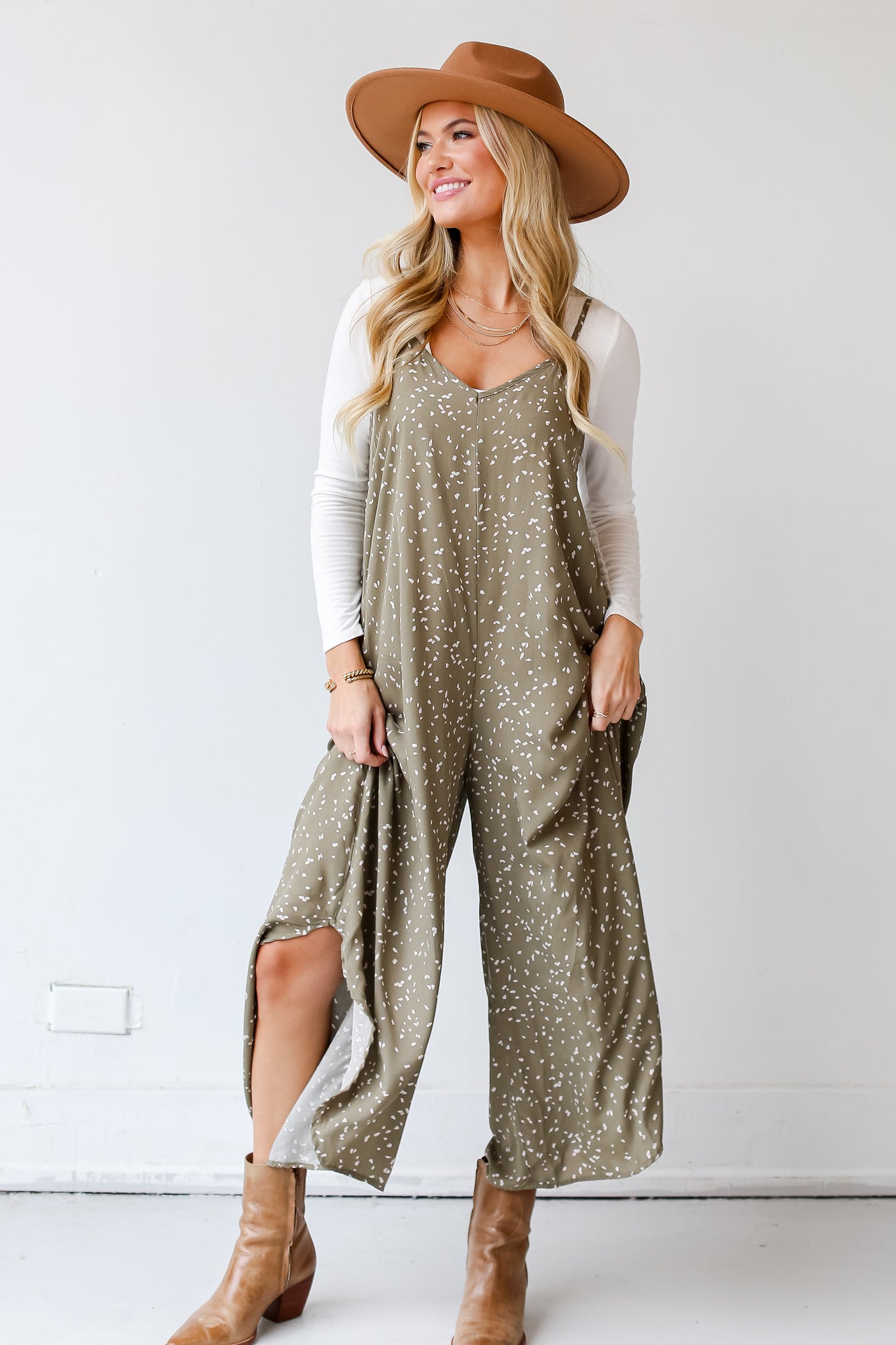 model wearing a olive Spotted Wide Leg Jumpsuit with brown booties