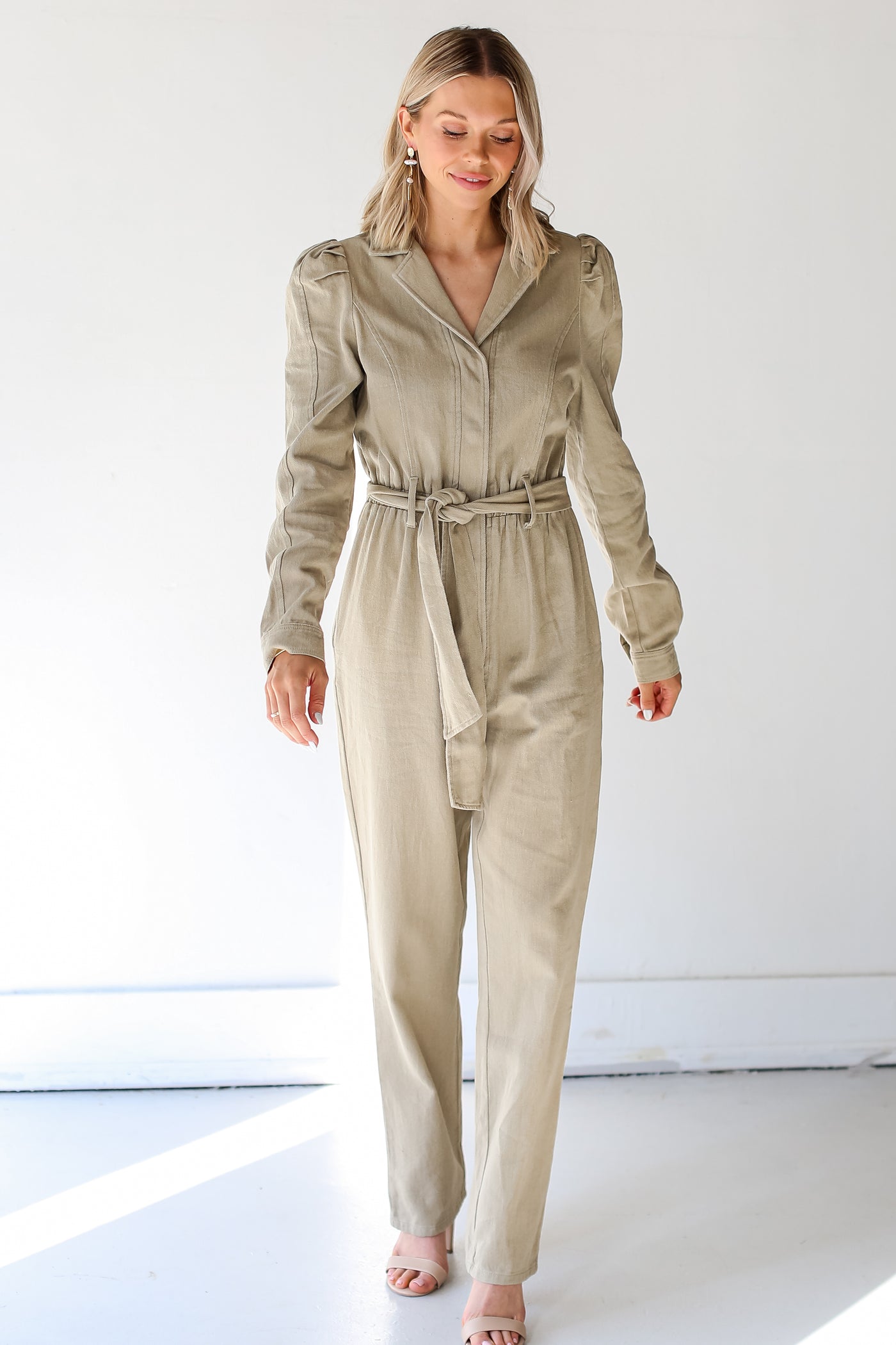 model wearing a taupe denim Jumpsuit