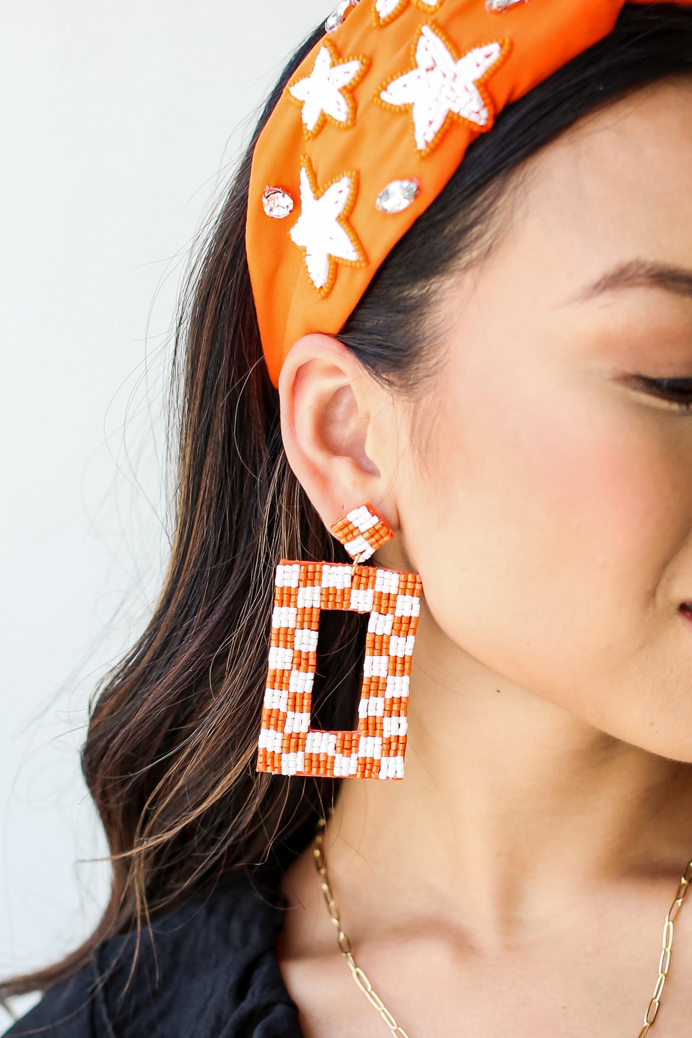 Orange + White Checkered Beaded Statement Earrings on dress up model