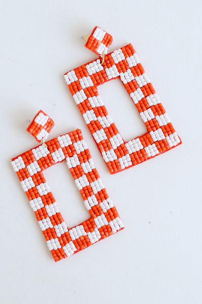 Orange + White Checkered Beaded Statement Earrings flat lay