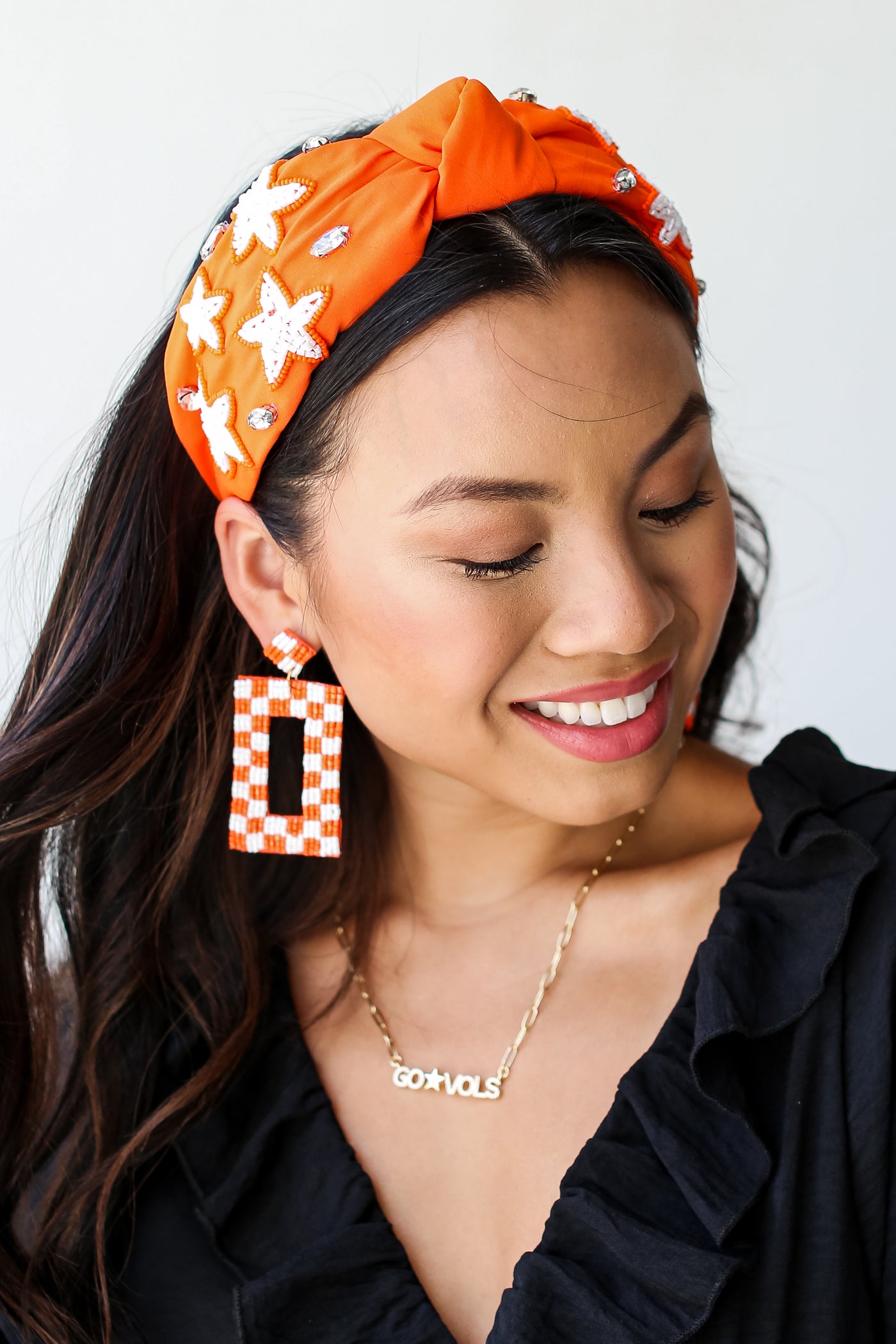 Orange Star + Gemstone Knotted Headband on model
