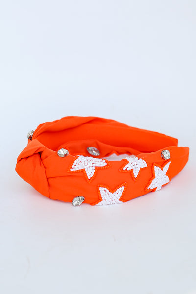 Orange Star + Gemstone Knotted Headband flat lay