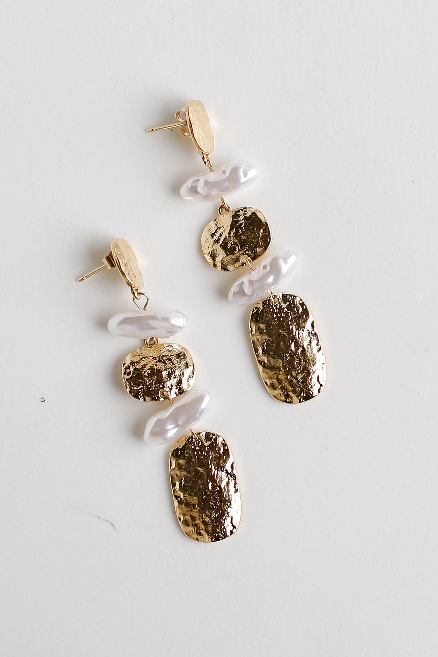 Gold Hammered Pearl Drop Earrings flat lay