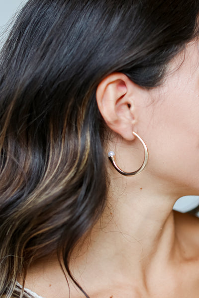 Gold Hoop Earrings on model