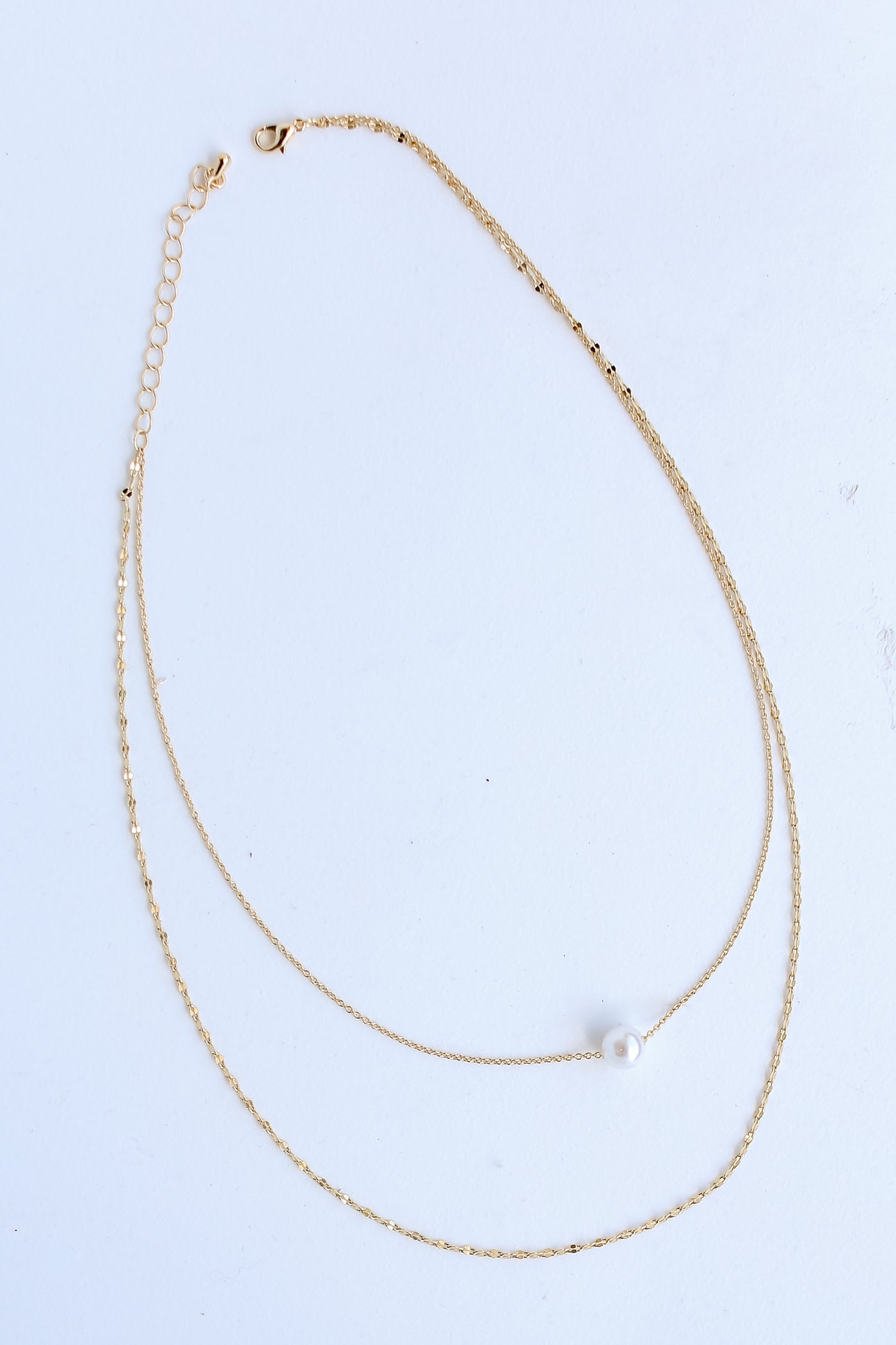 Gold Pearl Layered Chain Necklace flat lay 