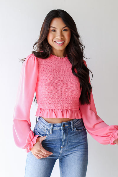 model wearing a pink Smocked Blouse