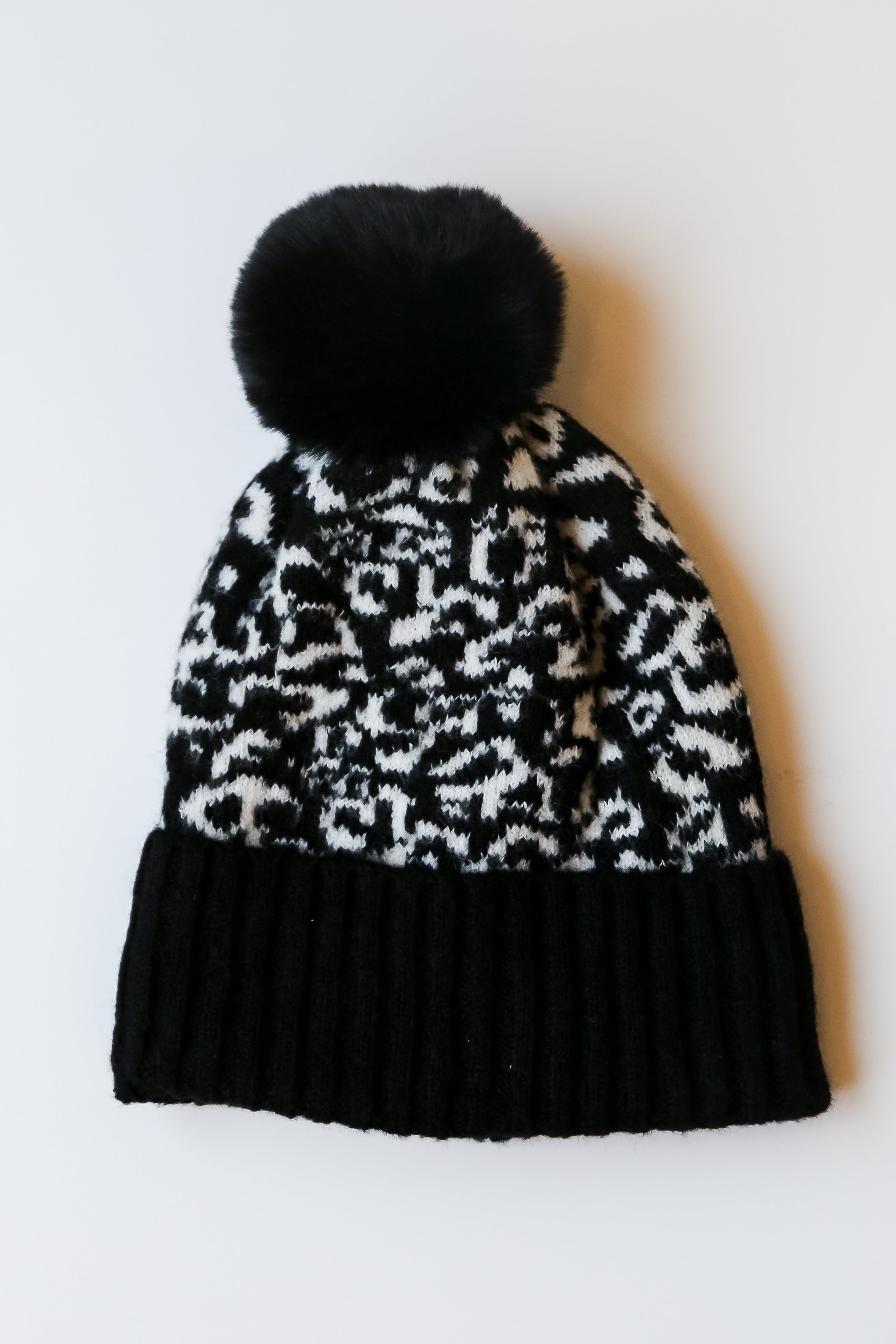 black Leopard Pom Pom Beanie flat lay