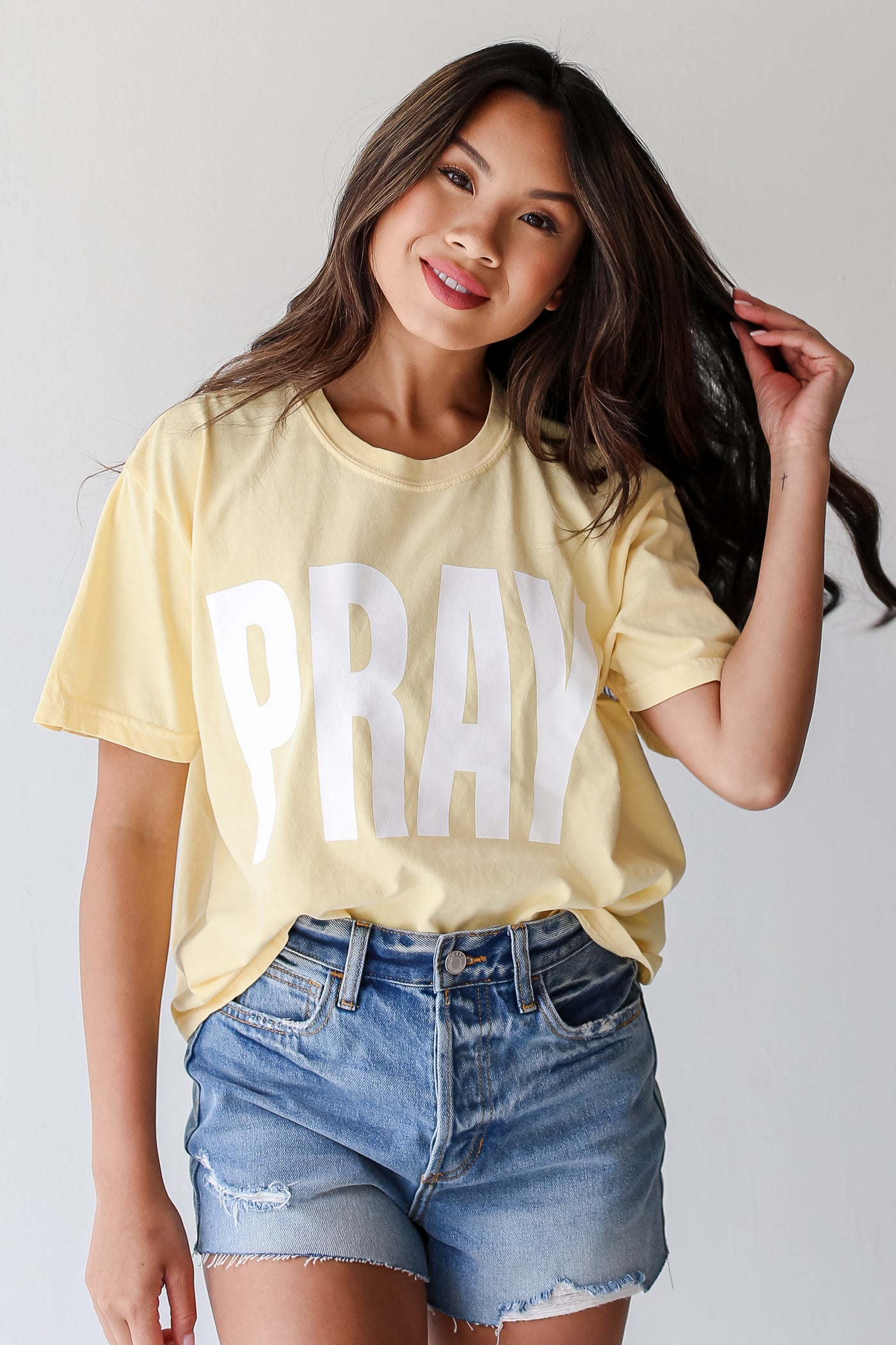 Yellow Pray Cropped Tee on model