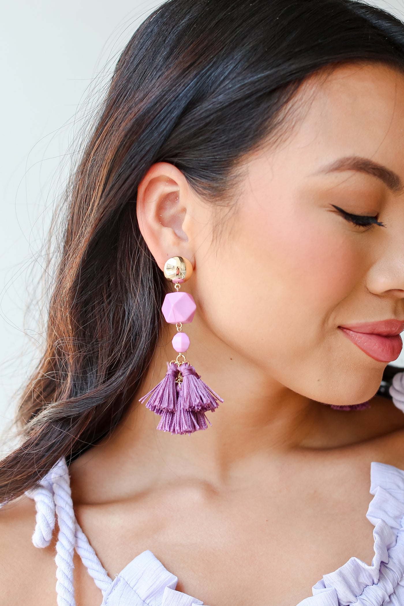 purple Tassel Statement Earrings on model