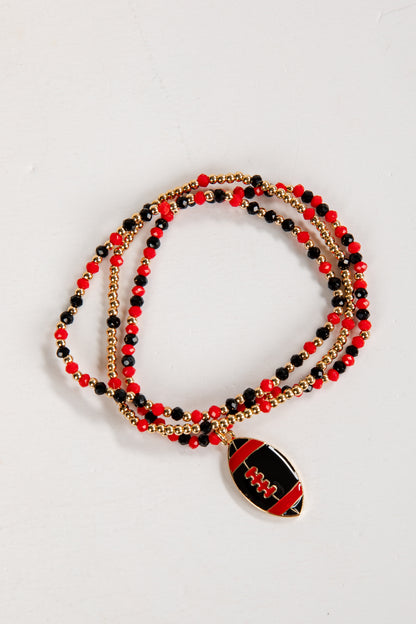 Beaded necklace with a football pendant on a white background