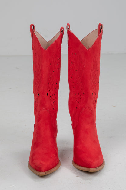 Pair of red cowboy boots on a white background