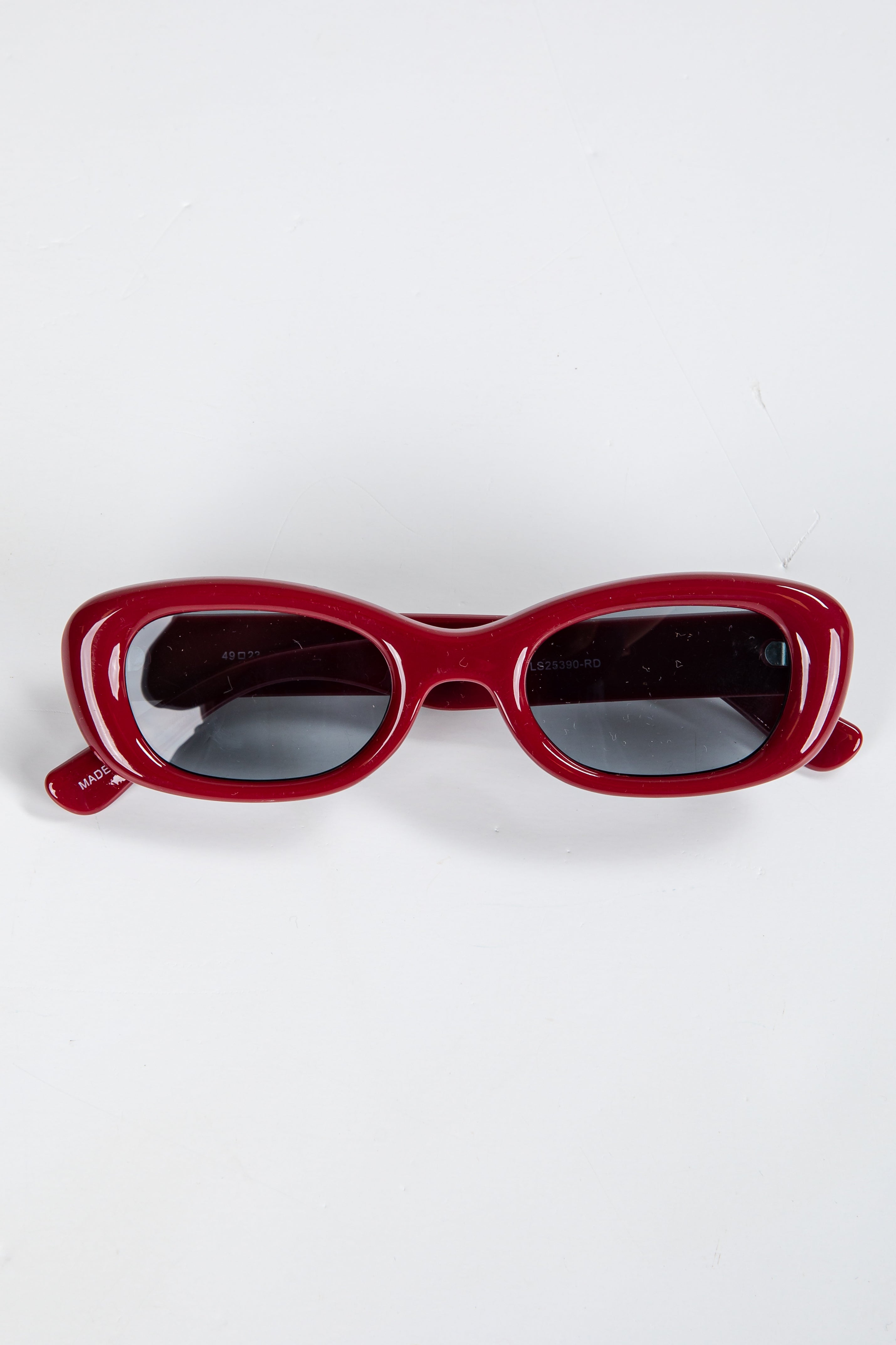 Red sunglasses on a white background
