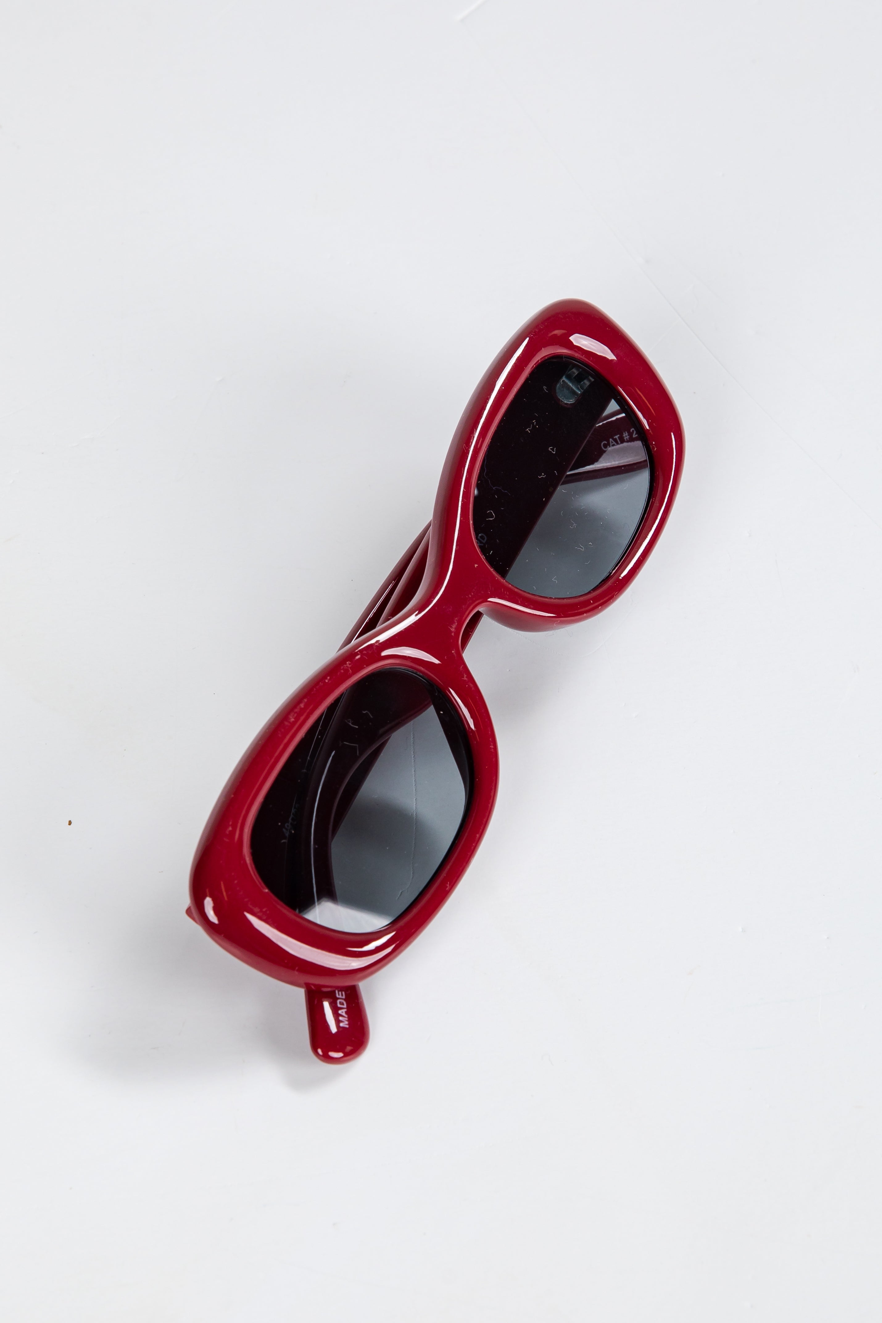 Red sunglasses on a white background
