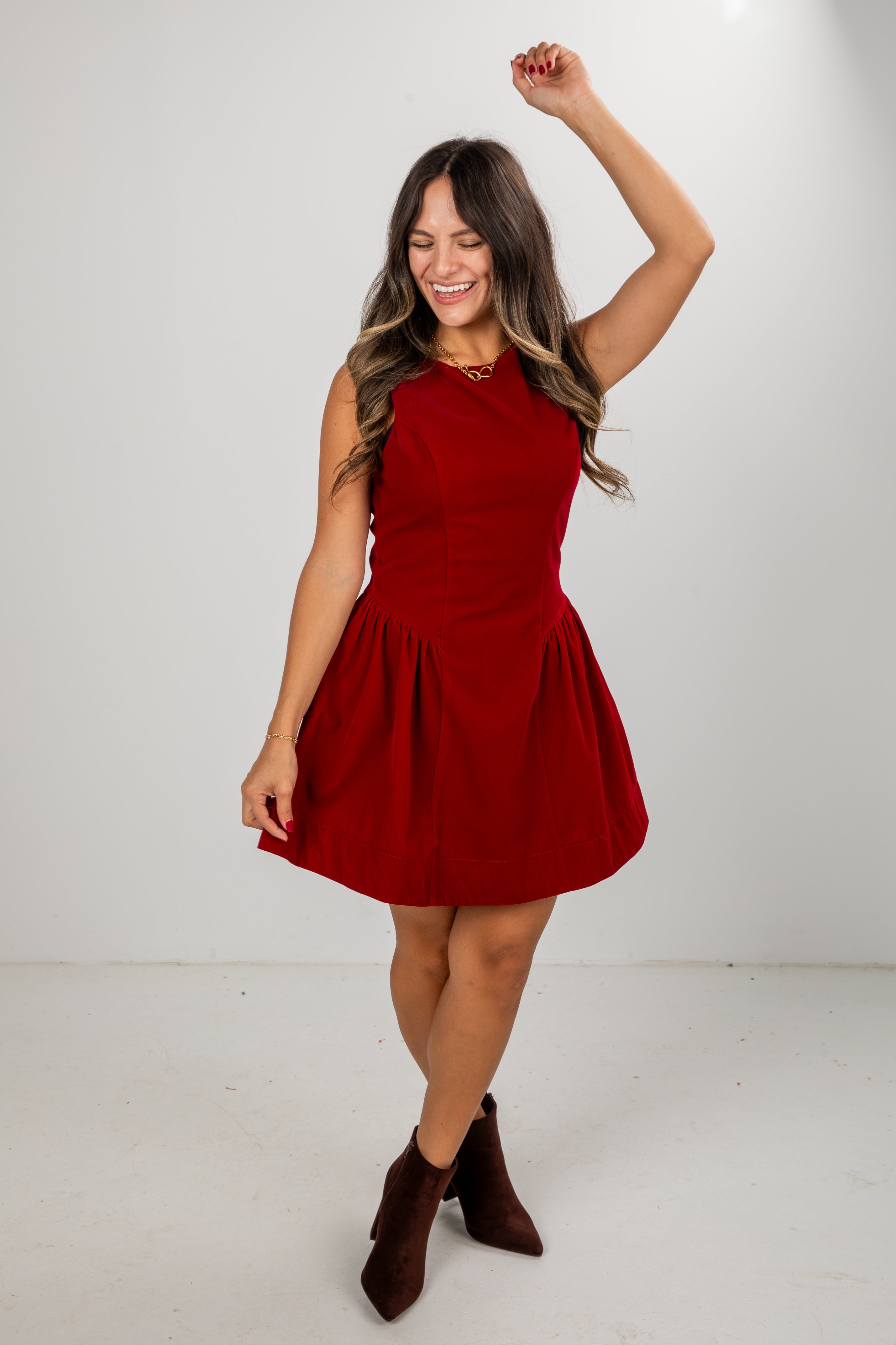 Woman wearing a red dress on a white background