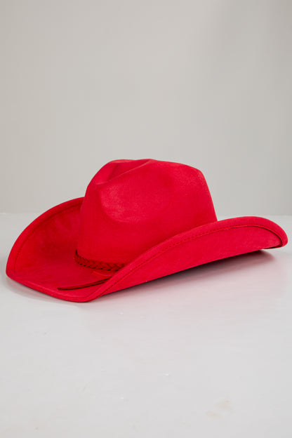 Red cowboy hat on a light gray background