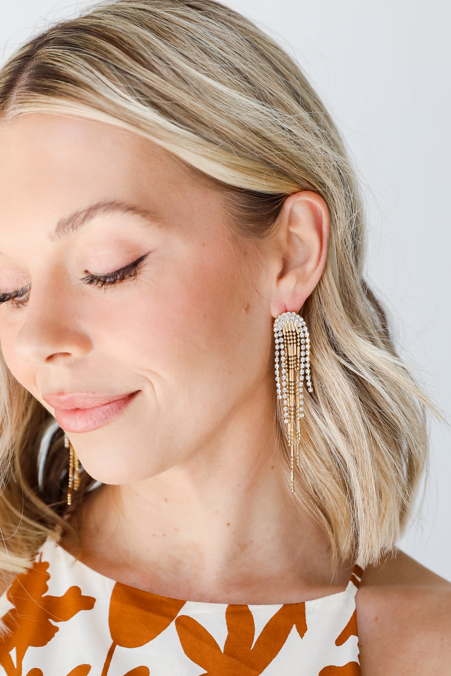 Gold Rhinestone Fringe Earrings on model