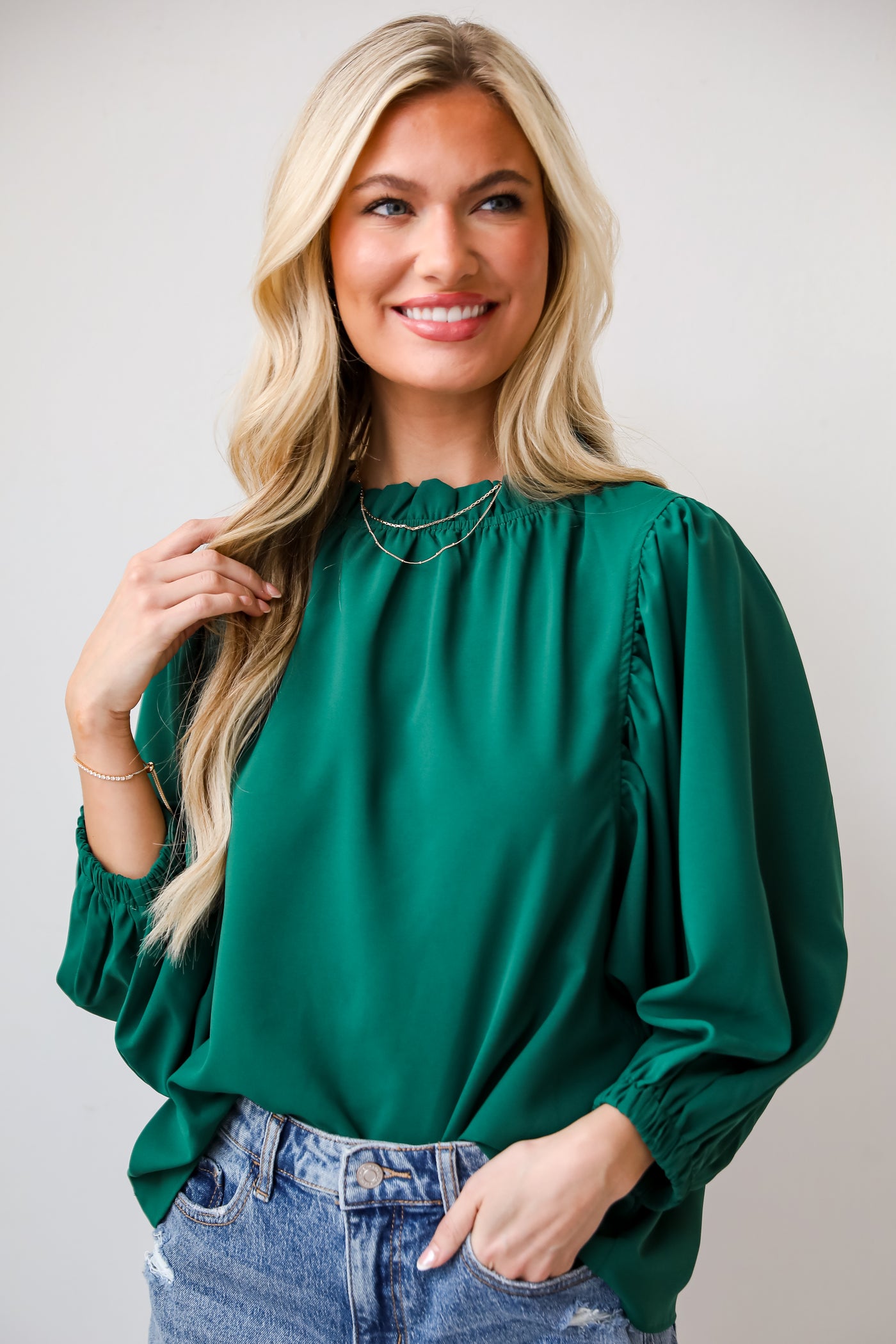 green ruffle blouse